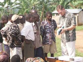 Teaching the Pigmy men to use a crank cassette to listen to the gospel