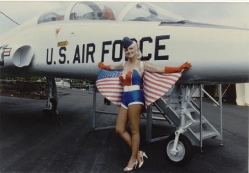 air force pin up in front of jet 